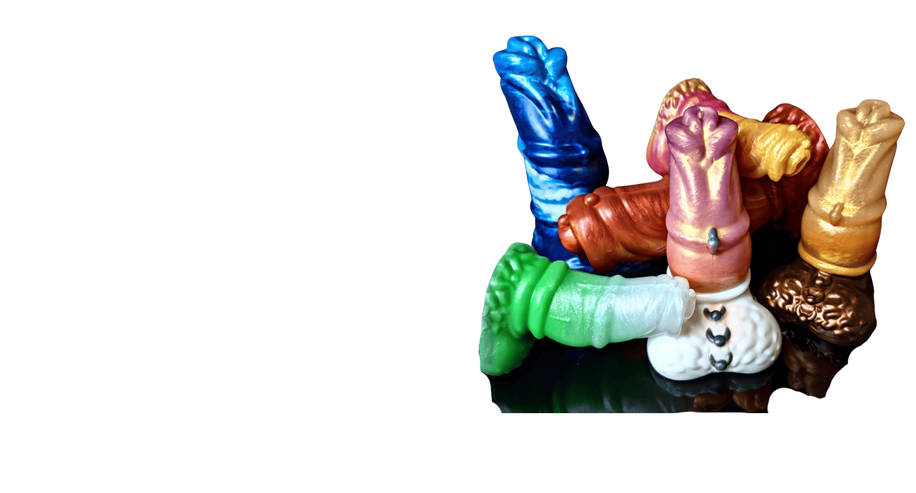 six sizes and styles of satyr fantasy dildo arranged in a pile